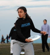 Sophomore Stacey Mosley, a member of Gung-ho, the women’s ultimate Frisbee team, tosses a disc during practice.