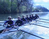 Will Defliese, first rower facing forward, and his crew teammates surge down the North Shore Channel in Evanston.