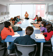 Michele Weldon (J79, GJ80), assistant professor of journalism, leads a writing class in the McCormick Tribune Center.