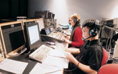 Medill students work the controls in a broadcast studio. With a growing emphasis on multimedia skills in the news industry, Medill students are encouraged to learn to produce content for audio, video and text.