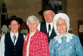 Mary Ellen Strong Lewis (WCAS45) poses with members of a folk group that presented "Los Cordillos del Buguo" at a local school in Sarlat.