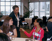 Council of One Hundred member Gail Durham Hasbrouck (L74) greets students and young alumni during the club