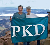 David and Pat Pokorny raise the PKD flag on Pikes Peak.