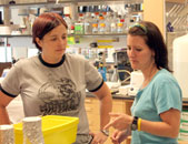 Researcher Liza Pfaff, left, and Lisa Hurley, a senior research technologist, work in J. Larry Jameson