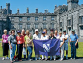 Northwestern travelers pose for a photo in the gardens of Kilkenny Castle.