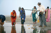 Williams records the sounds of Krishna devotee women making offerings along the bank of the Yamuna River in Vrindavan, India.