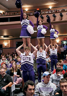 Cheerleaders work the crowd at the Homecoming pep rally.