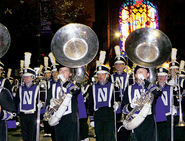 The Northwestern University Marching Band steps off on the Sheridan Road parade route.