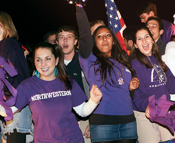 Pi Beta Phi and Sigma Alpha Epsilon members on their float at the Homecoming parade