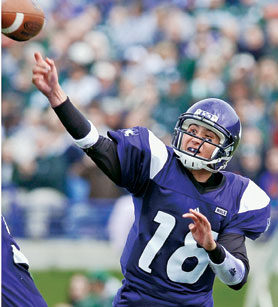 Wildcat quarterback C.J. Bachr throws a pass during the Homecoming game.