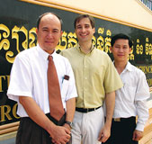 Steven Austermiller, center, with law professors Hor Peng, left, and Khim Kiri, right, at the Royal University of Law and Economics in Phnom Penh, Cambodia