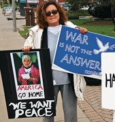 Lolly Voss protests the war in Iraq with the DeKalb (Ill.) Interfaith Network for Peace and Justice.