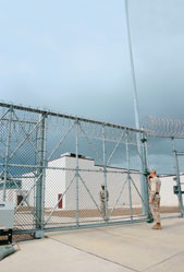 U.S. security forces guard the main entrance to Camp 6, the new maximum security facility at the U.S. Naval Station in Guantnamo Bay, Cuba.