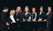 From left to right, Tony Award-nominee Ral Esparza, Elizabeth Stanley, Kristin Huffman, Heather Laws, Amy Justman, Leenya Rideout and Barbara Walsh perform the song "Poor Baby" during a production of <em>Company</em>.