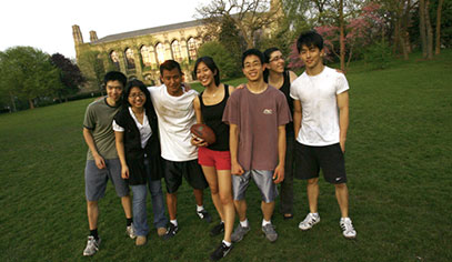 Students playing ball on Deering Meadow