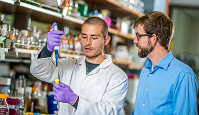 Student and professor in a lab