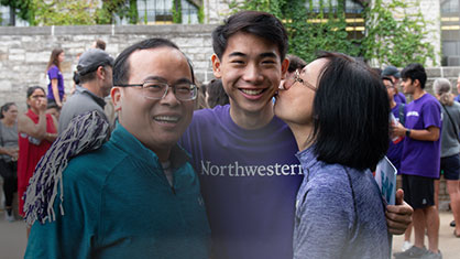 parents kissing goodbye to their student