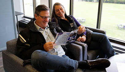 parents looking at brochure