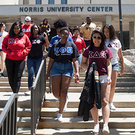 greek students walking out of Norris Center