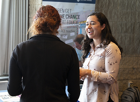 two students with interview materials