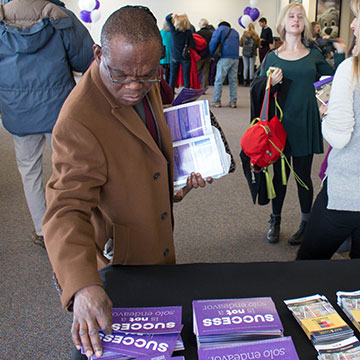 family member checking out brochures family weekend