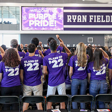 students singing fight song at purple pride