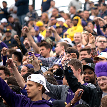 students cheering at football game