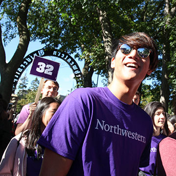 students marching through the arch at Northwestern