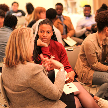 student talking to staff