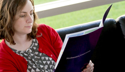 staff reading a brochure