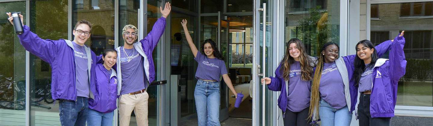 A group of RAs welcoming at a residence hall