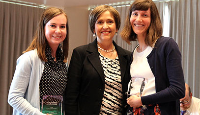 staff receiving award from Patricia Telles-Irvin