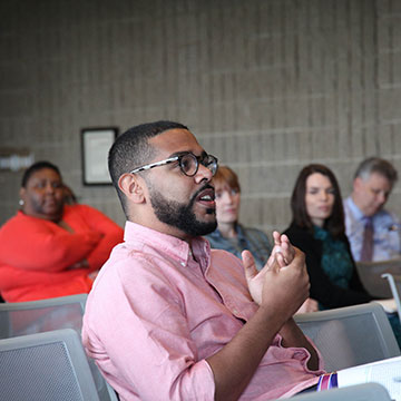 staff speaking at a staff conference