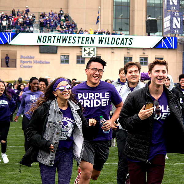 freshman dashing across the field before the home game