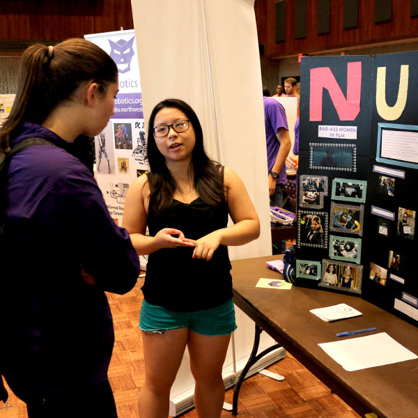 students chatting at the fair