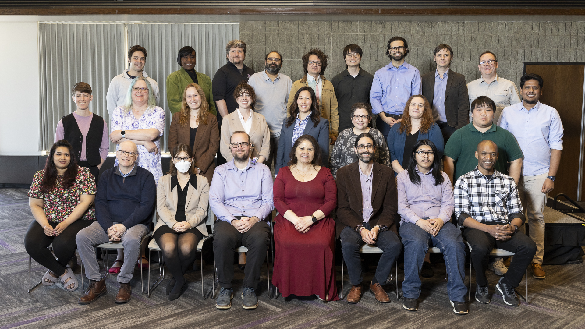 Members of the team in 3 rows