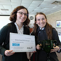 students with check and trophy