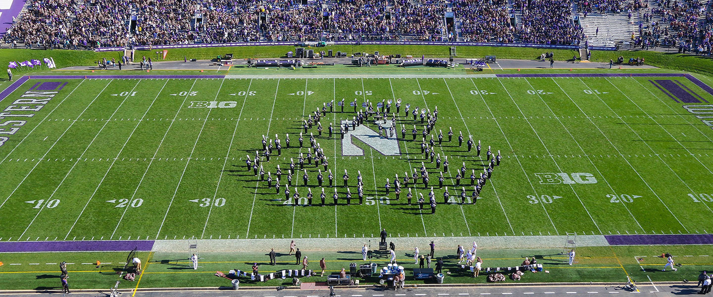 marching band makes recycling logo