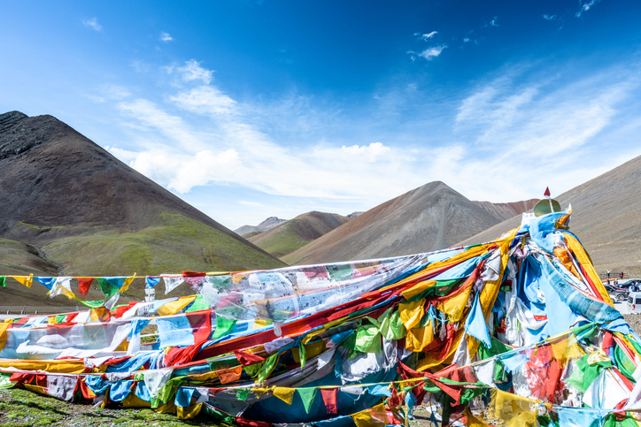 colorful tent at the base of a mountain