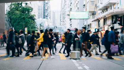 group of people crossing a street