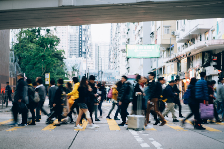 group of people crossing a street