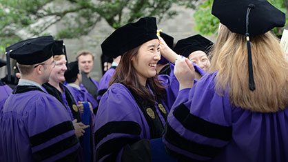 students at hooding ceremony