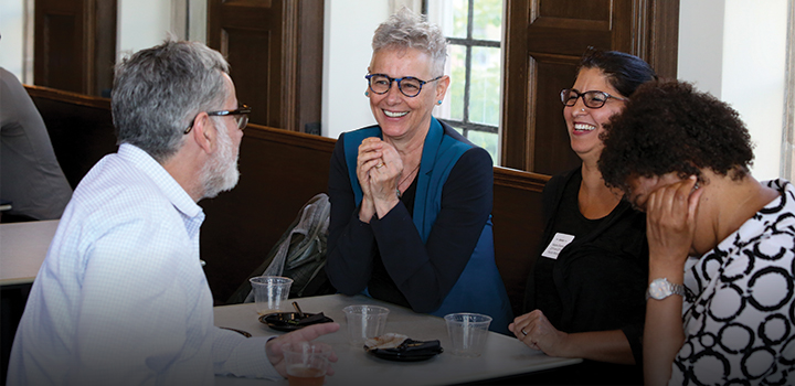 faculty and staff talking