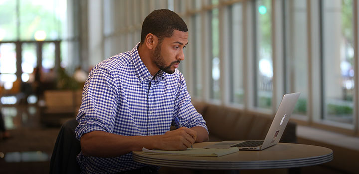 student working in front of laptop