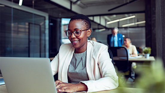 Woman working on a laptop in the office