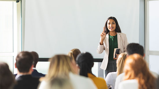 female professor giving a lecture to the class