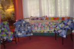 Quilts made by the Piecemakers displayed before donation to charities