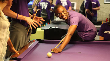 Students playing pool at Norris