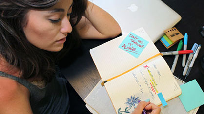 woman writing in journal