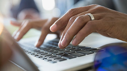 women typing on a keyboard